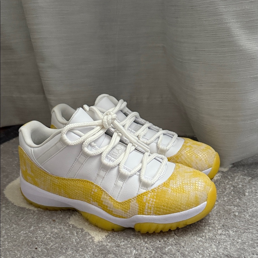 Women’s Yellow Snakeskin Jordan 11 lows.
